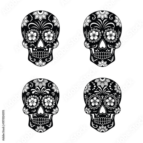 A collection of four intricately detailed black and white mexican sugar skulls with floral patterns
