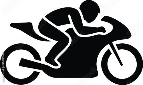 Motorcycle rider in racing position on bike  speeding down track with helmet and gear