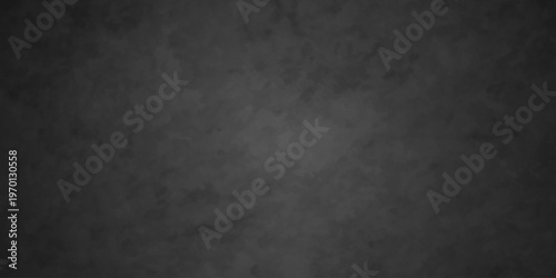 Dark charcoal grunge wall texture background. Dark black rough grunge surface with smoke edge. Black texture chalk board and black board.