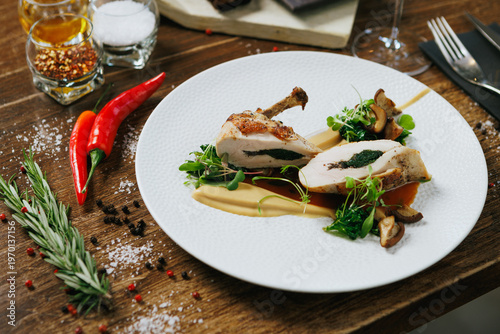 Indulge in our Gourmet Stuffed Chicken Breast, perfectly paired with a flavorful Herb Sauce