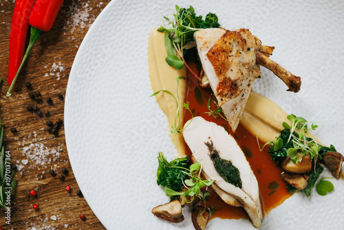 Indulge in our Gourmet Stuffed Chicken Breast, perfectly paired with a flavorful Herb Sauce