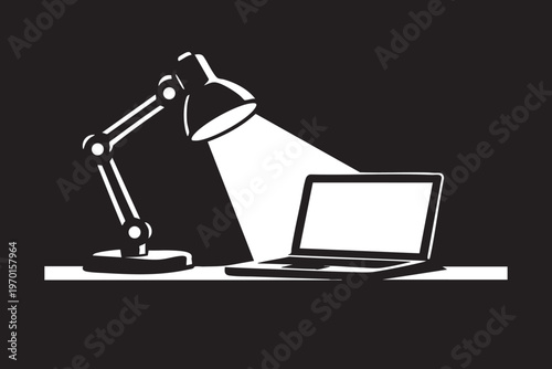 Late night study or work with desk lamp and laptop.