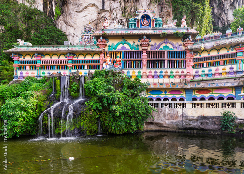 Vibrant Valluvar Kottam, Cave Villa Hindu temple with waterfall and pond at Batu Caves, Kuala Lumpur, Malaysia