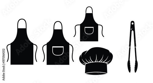 Black kitchen aprons chef s hat and tongs in a stark silhouette
