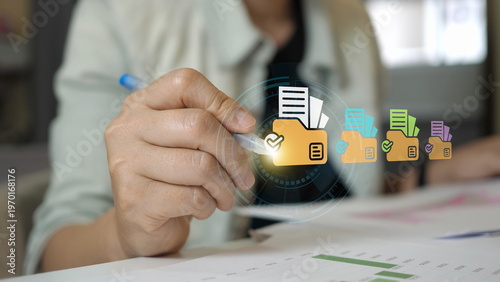 Digital document management and file organization system on laptop screen, user verifying folder with approval checkmark for secure data storage and online workflow control