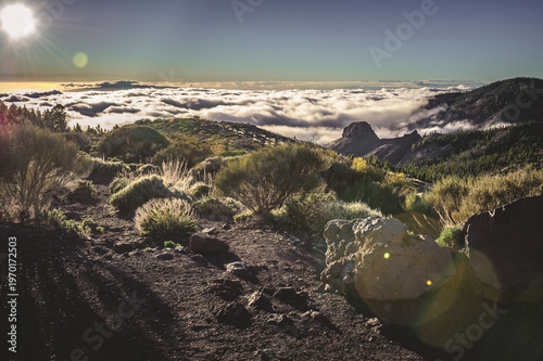 Dramatic Tenerife Landscape with High Mountains Rising Above Clouds and Rugged Volcanic Scenery in Teide National Park.