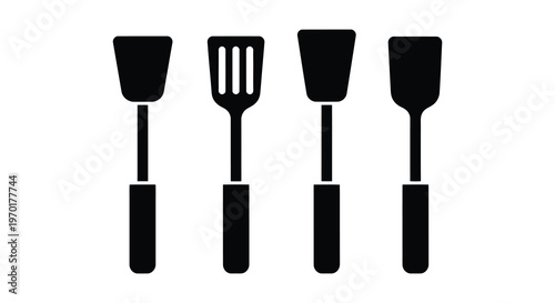 A collection of four black kitchen spatulas and turners displayed in a stark graphic silhouette high quality professional