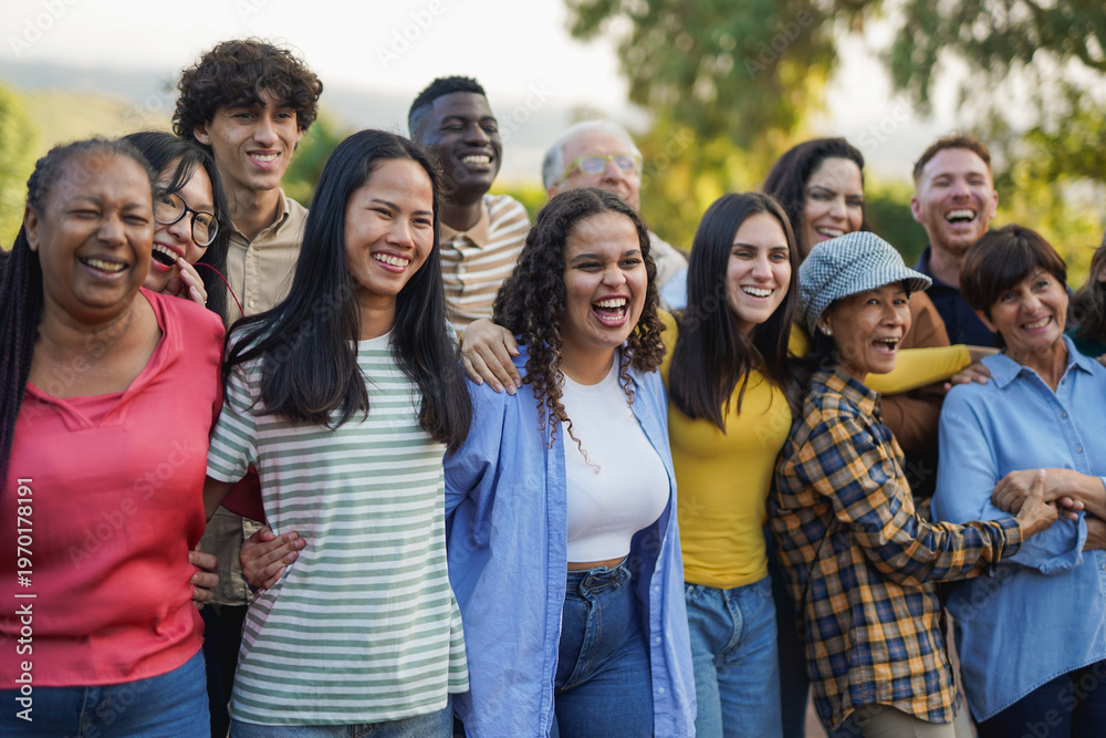 Fototapeta premium Group of multiracial people with different ages having fun together at city park - Community and social gathering concept