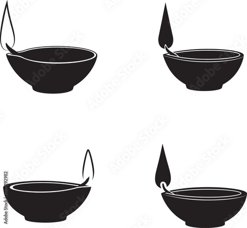 Vector silhouette of diyas or earthen lamps with flame