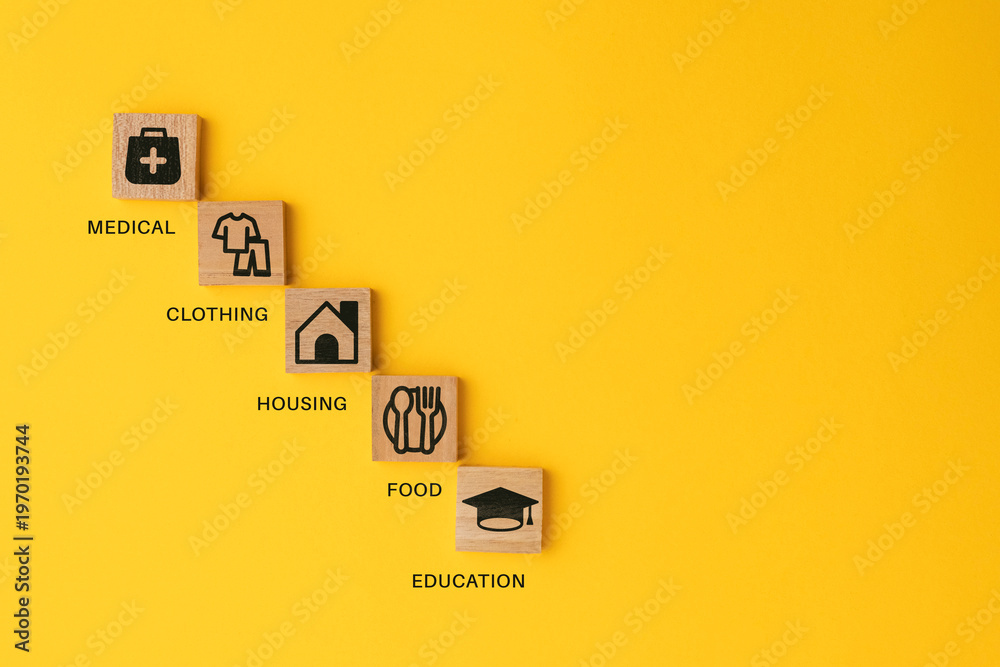 Ταπετσαρία wooden cube with icons of food, Clothing, housing, medical bag, four basic human needs concepts