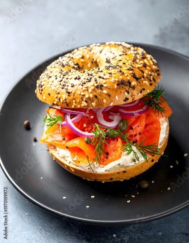 Delicious Lox Bagel Sandwich with Sesame Seeds Cream Cheese Dill and Red Onion
