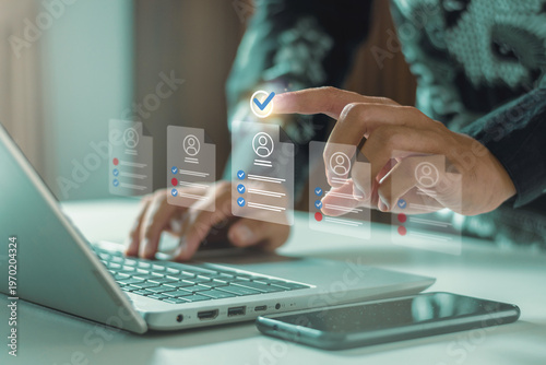 Recruiter reviewing online job applications. Concepts include digital transformation, remote hiring, automated recruitment, data-driven HR, workspace efficiency, and professional screening