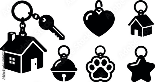 Black house keychain silhouette with three smaller key charms star heart bell and paw
