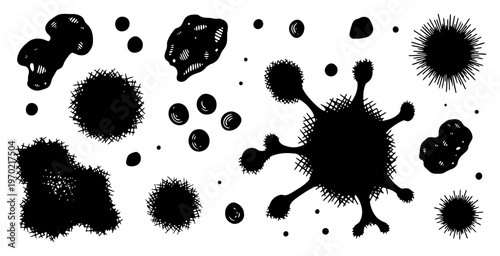 Collection of organic ink splatters and textured blots in hand drawn style