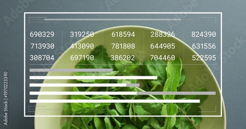 Showing pale green bowl holding arugula on dark table with white overlay, six-digit labels and bars