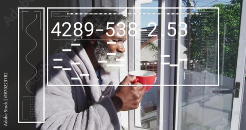 Holding red mug, senior man in gray bathrobe sipping, looking out to balcony with HUD overlay