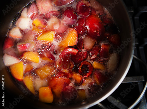 Peach, berries and cherries boiling 