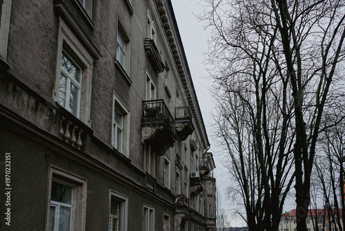 Old European apartment building with balconies on a cloudy day