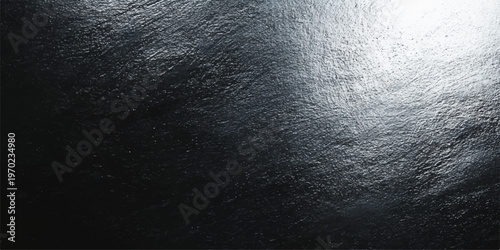 Elegant gray metallic texture background, a dark, abstract surface reflecting light, providing a sense of depth and tactile allure.