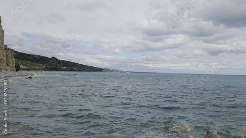 Wallpaper Mural View of a beach with the tower of a medieval castle in Calabria, Italy. Torontodigital.ca