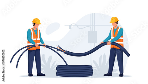 Two electricians working together installing electrical cables.