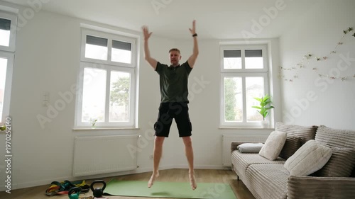 Man Jumping With Overhead Claps During Home Workout