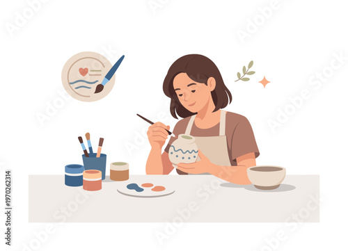 A pottery painting workshop scene where a person decorates a ceramic object with simple patterns in a calm creative environment, a plate and a brush