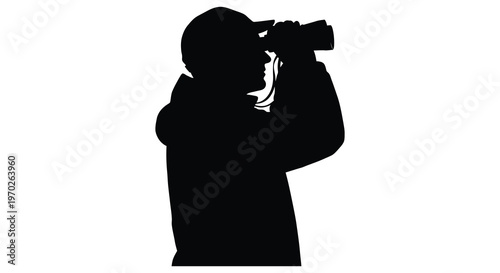 Photographer with binoculars observing a striking black form silhouette high quality