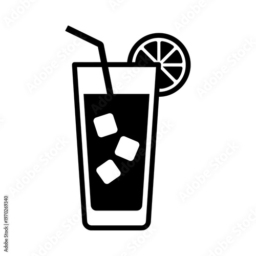 Tall glass of cold lemonade with ice cubes and lime slice