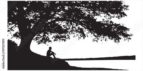 Silhouette of a person sitting under a tree with a sunset view