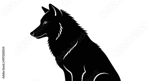 Majestic black wolf silhouette sitting in profile.
