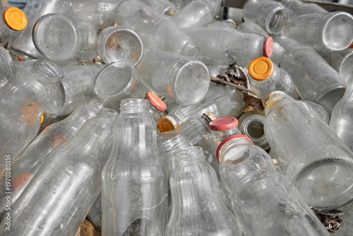 Used glass containers intended for recycling, selective focus.