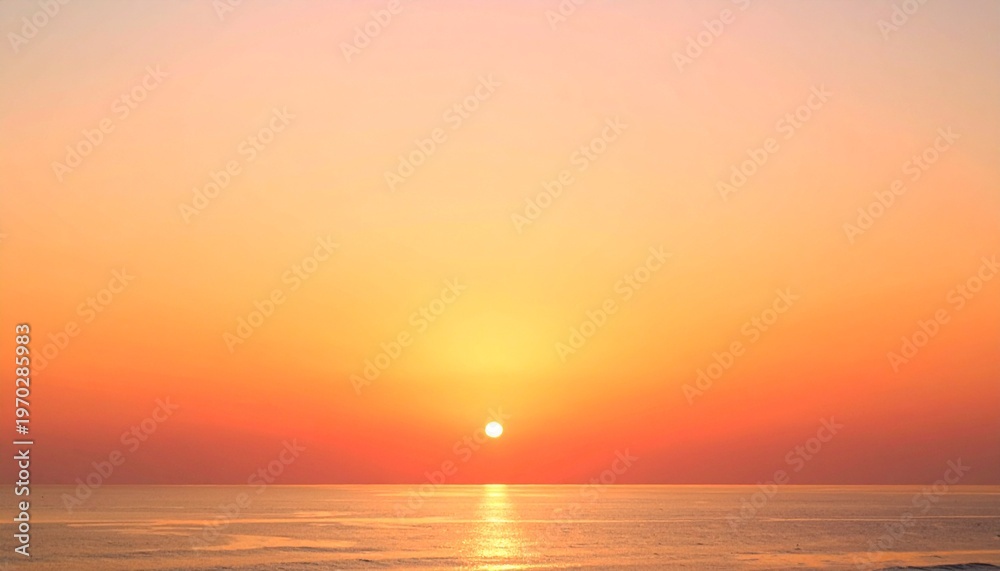 Obraz premium Vibrant ocean sunset with golden horizon and warm glowing sky