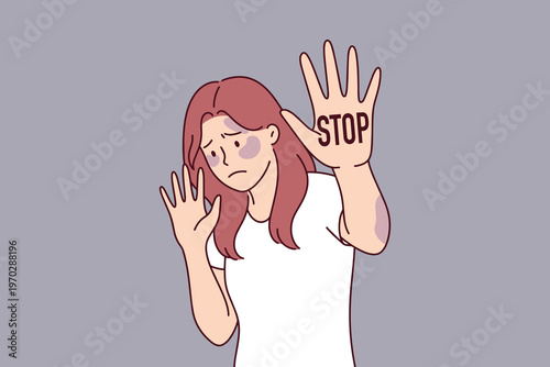 Young woman showing bruise and palm with word STOP. Powerful visual for domestic violence awareness, social justice campaigns, and victim protection messages in soft colors.