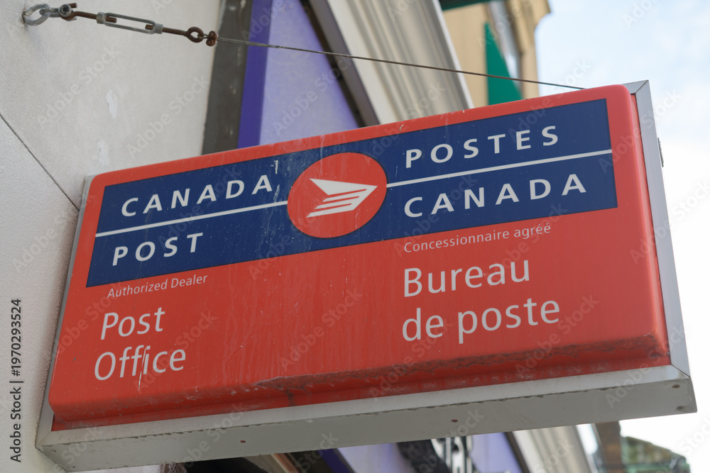 Obraz premium wall mounted illuminated box projecting sign outside a Canada Post, Post Office on Yonge St, Toronto