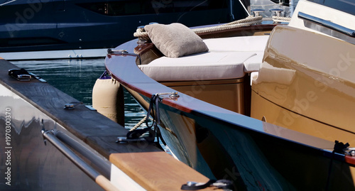 Photos Soft pillow on the bow of a motorboat moored at the dock