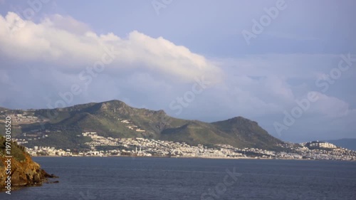 Magnificent sunset on a cloudy day over the Aegean Sea in autumn.	
