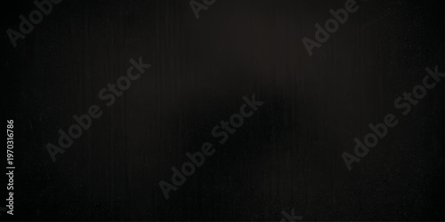 Dark grunge background featuring a weathered brown wood texture and old black paper pattern on a rough vintage wall surface for a textured design backdrop