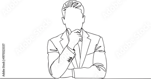 Businessman in suit and tie with hand on chin thinking