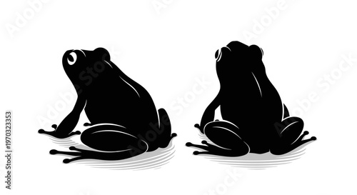 Two Black Frogs Silhouettes Facing Different Directions.