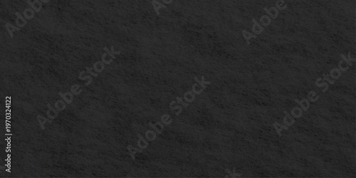 A dark, blank surface featuring a rough black paper background blended with a grunge textile pattern and macro fabric material for a textured charcoal gray canvas backdrop