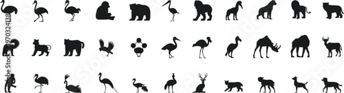 Animal silhouette illustration, thirty diverse wildlife figures including birds, mammals, and aquatic 