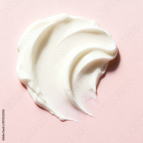 Photos White cosmetic cream smear or gel texture isolated on light pink background