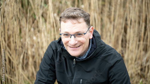 Seated portrait man reeds background Brussels