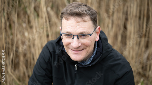 Seated portrait man reeds background Brussels