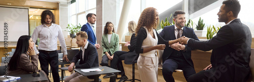 Business handshake colleagues meeting networking team partnership professionals. In a bright modern office diverse coworkers discuss and build trust. Corporate partnership and collaboration concept.
