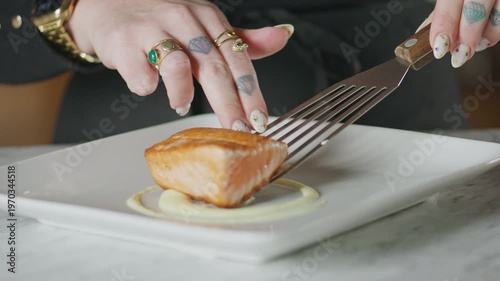 Wallpaper Mural Chef plates salmon with creamy sauce on a white plate. Torontodigital.ca