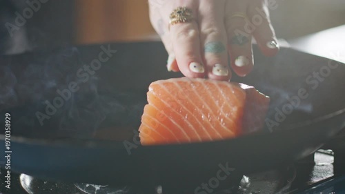 Wallpaper Mural Salmon fillets placed in a hot pan, sizzling on the stovetop. Torontodigital.ca