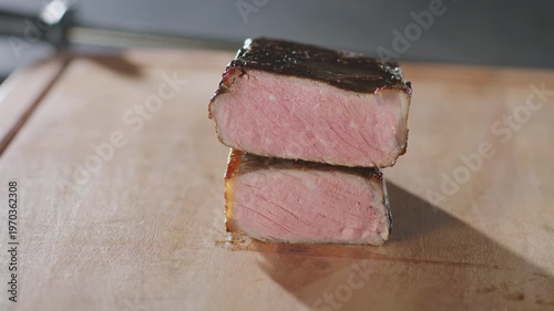 Wallpaper Mural Two stacked slices of medium-rare NY strip wait to be sliced on a wooden cutting board. Torontodigital.ca