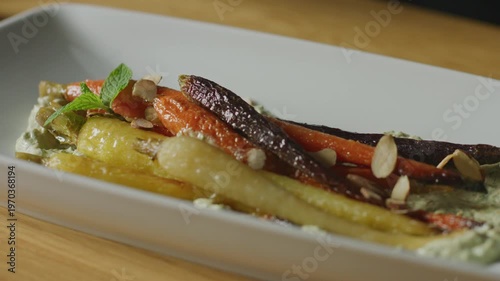 Wallpaper Mural Roasted rainbow carrots with fresh mint and sliced almonds on a plate. Torontodigital.ca